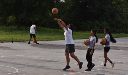Students playing basketball.
